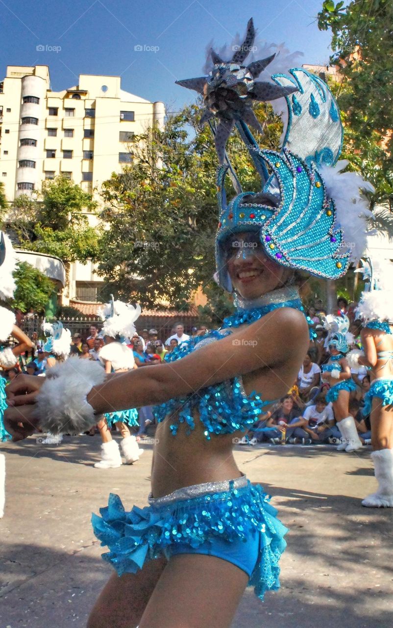 Dancing girl wearing blue clothes during the Barranquilla's Carnival