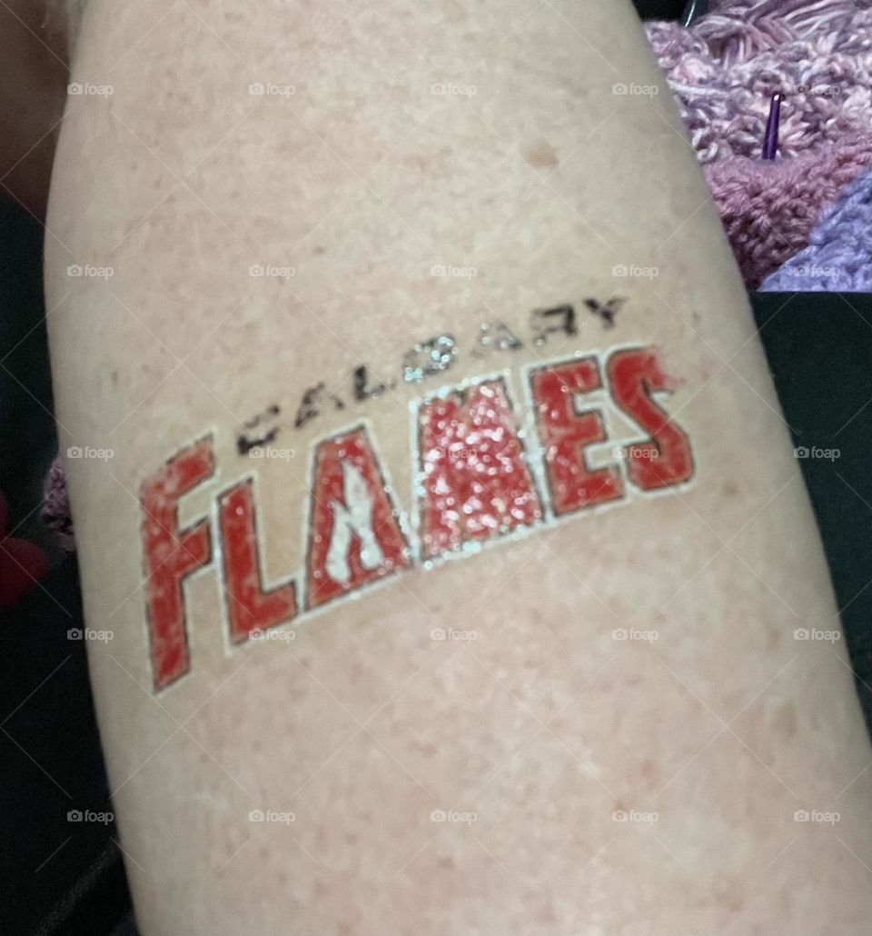 Arm tattoo of my favorite hockey team, Calgary Flames