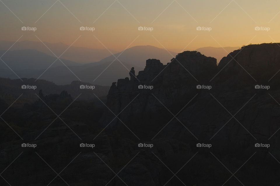 Silhouette of mountain range during sunrise