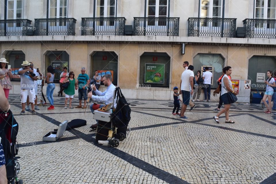 Man playing with his traditional musical instruments 