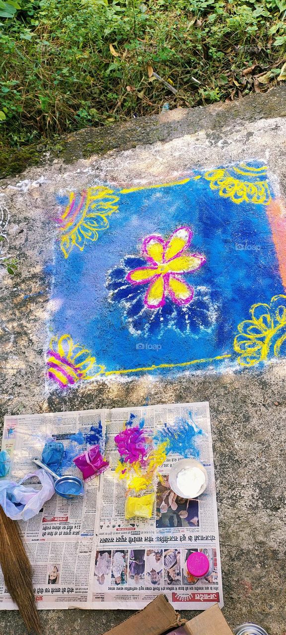 Beautiful rangoli made in front of entry door during Diwali with lots of colours and love poured in it.