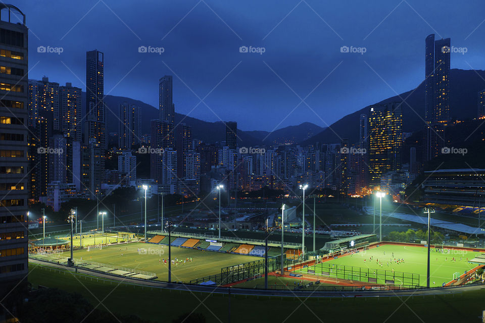 Happy Valley, Hong Kong . At night, with sport grounds lit up 