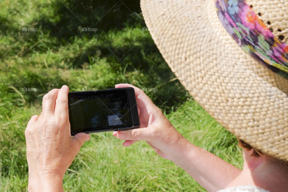 Phone. Camera phoneTourist taking a picture with a smartphone cell phone mobile phone camera 