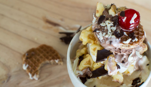 Waffles layered with ice cream in bowl