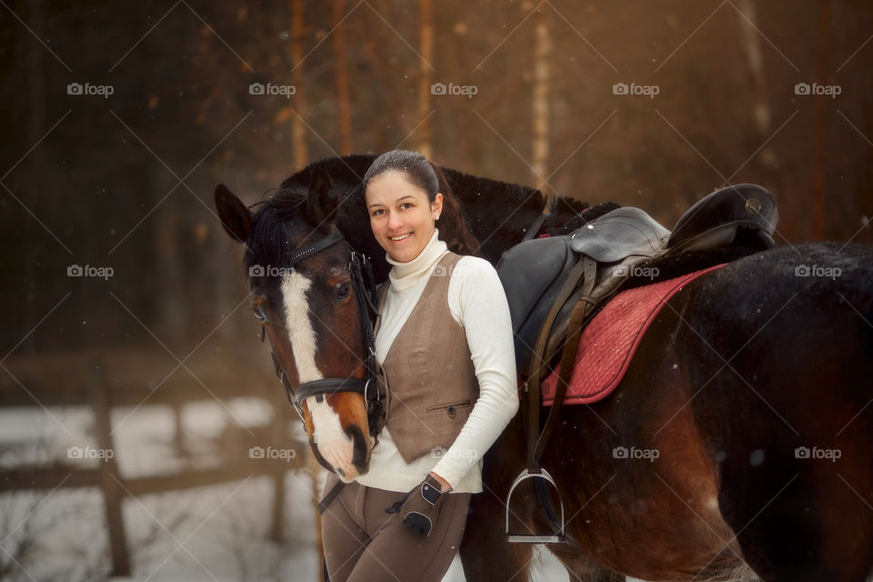 Young beautiful woman with horse outdoor portrait at spring day