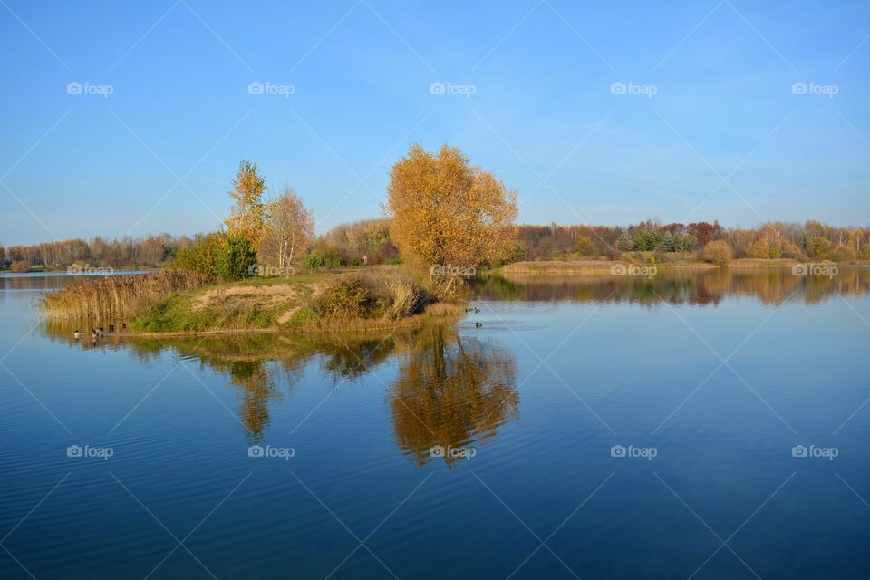 beautiful autumn nature landscape lake and reflection