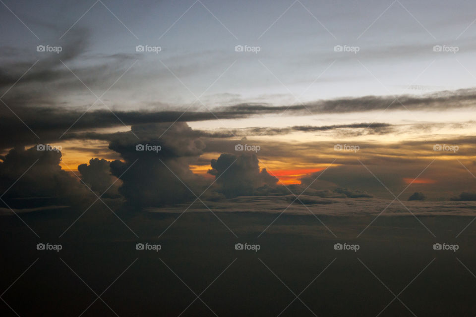 Aerial view of sunset, above clouds