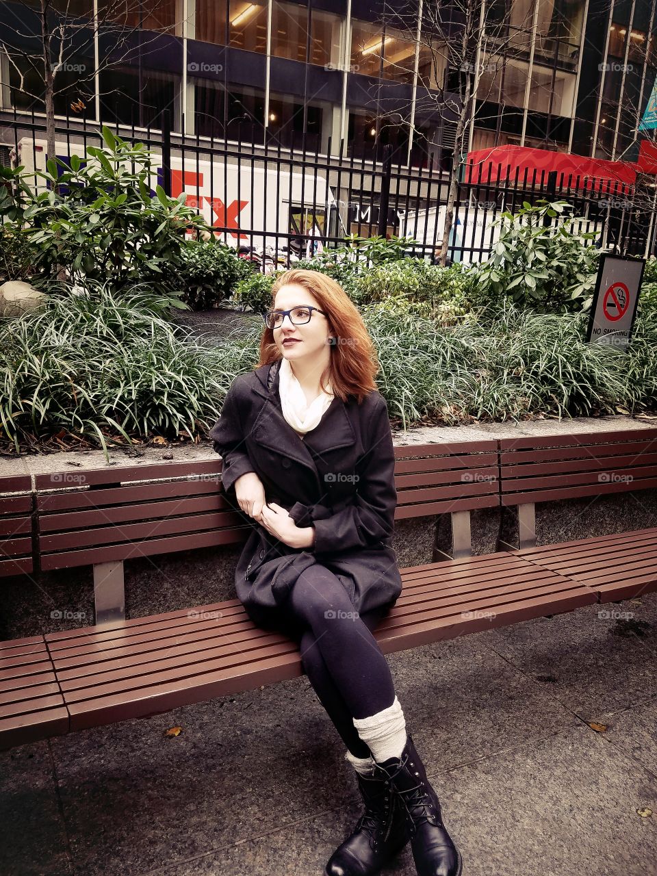 Portrait of a woman sitting on bench