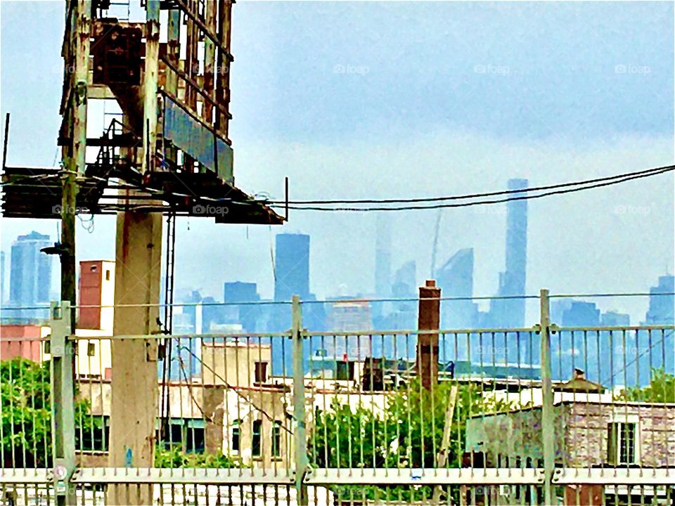 A New York cityscape photographed while traveling by car from Long Island City, Queens to Fort Greene, Bklyn on a slightly overcast morning in the summertime of 2021. Hypnotic Productions