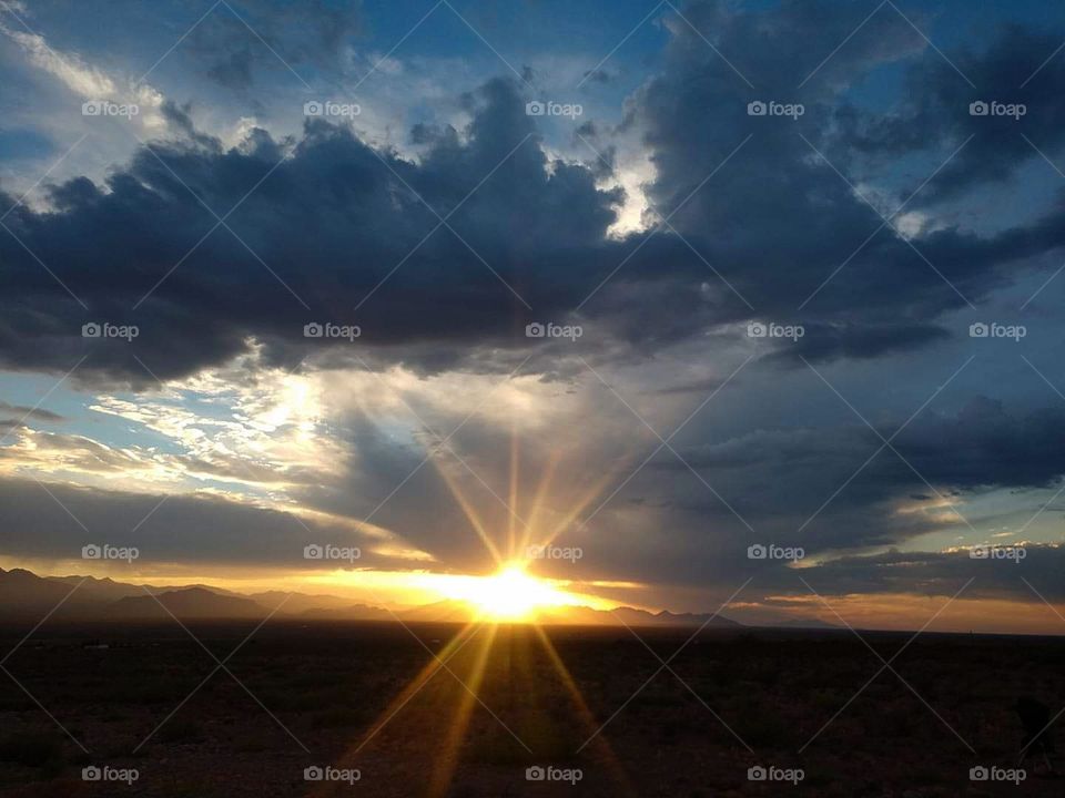 Sunset over the Chiricahua Mtns, AZ with sunbeams