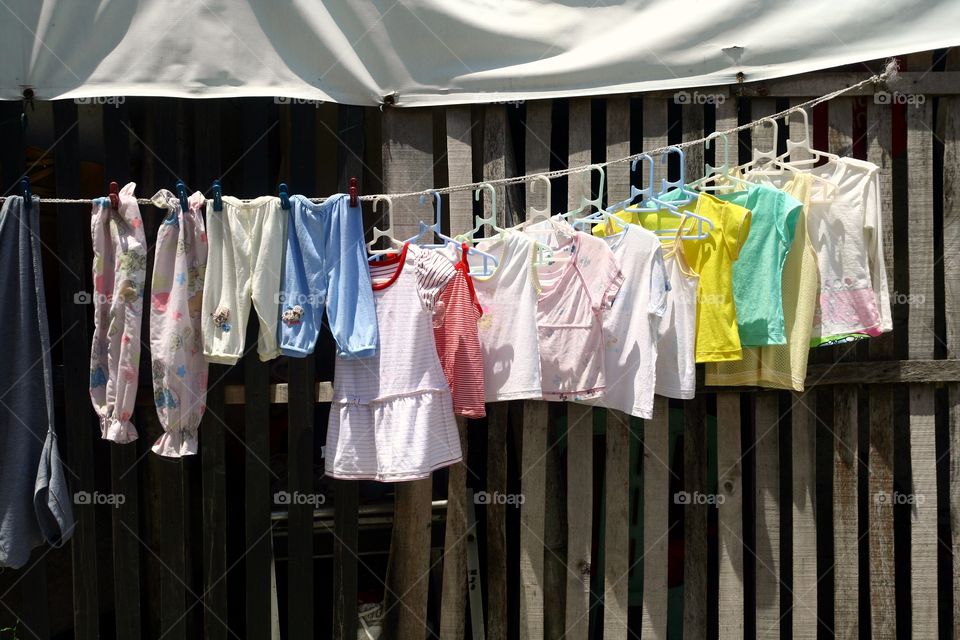 washed clothes hung to dry. washed clothes hung to dry on a clothes line