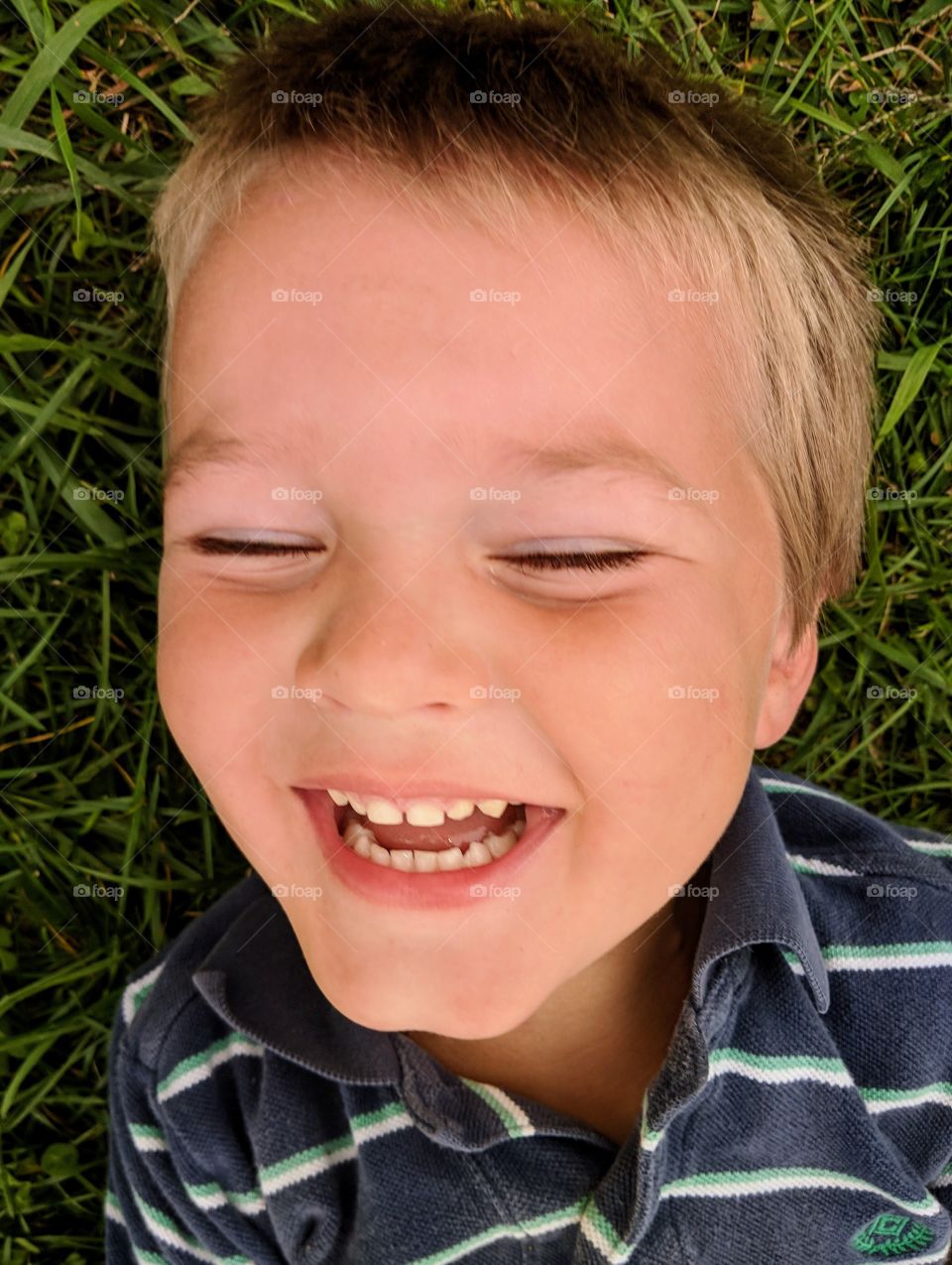 toddler boy laughing