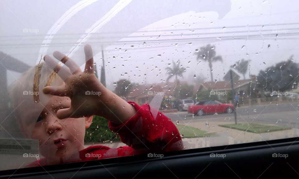 steam writer. my son writing in the steam on the car window