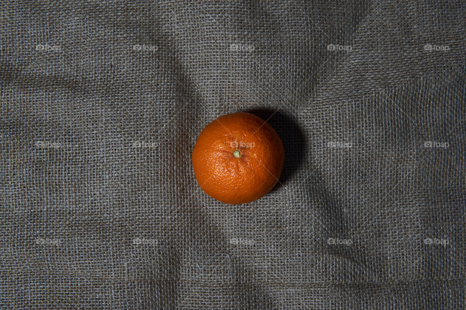 Orange fruit on a grey background. top view