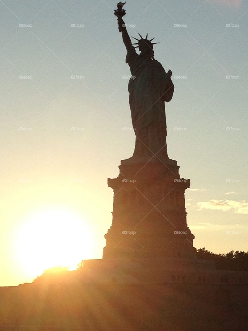 Statue's sunset. New york