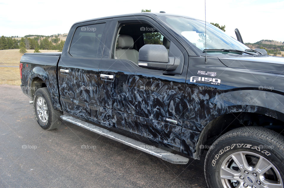 This is what our truck looked like after bison licked off salt on our drive through Custer State Park in South Dakota. 