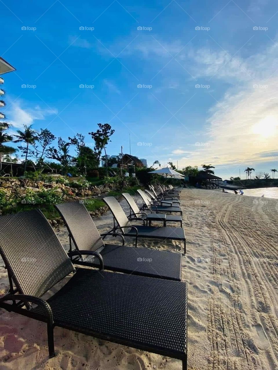 An empty benches in Santa Ana beach resort