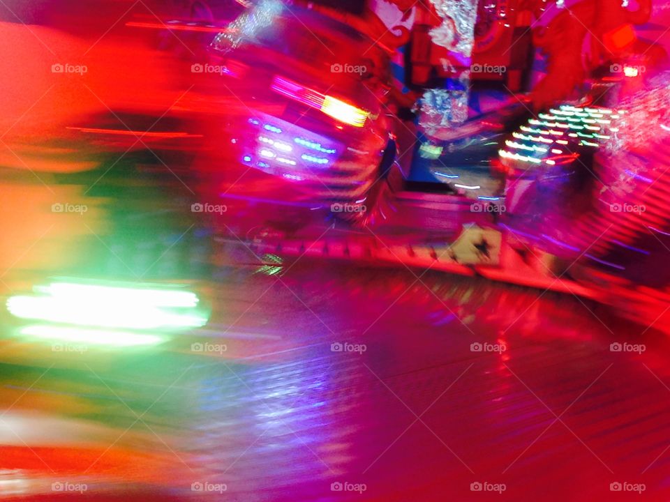 Fairground lights ride move fast