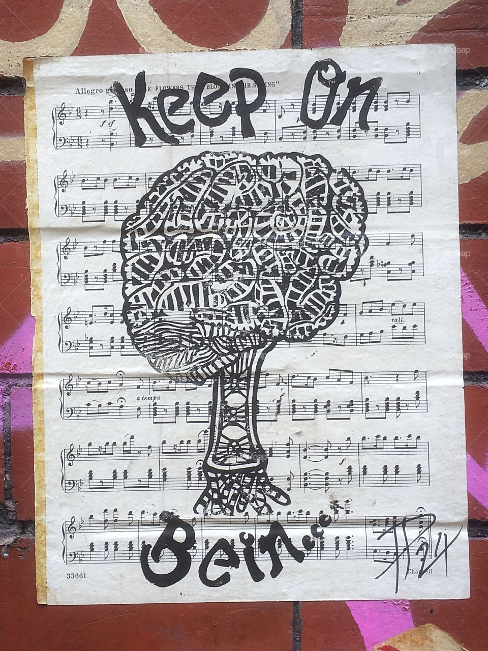 Keep on being sheet music paste street art