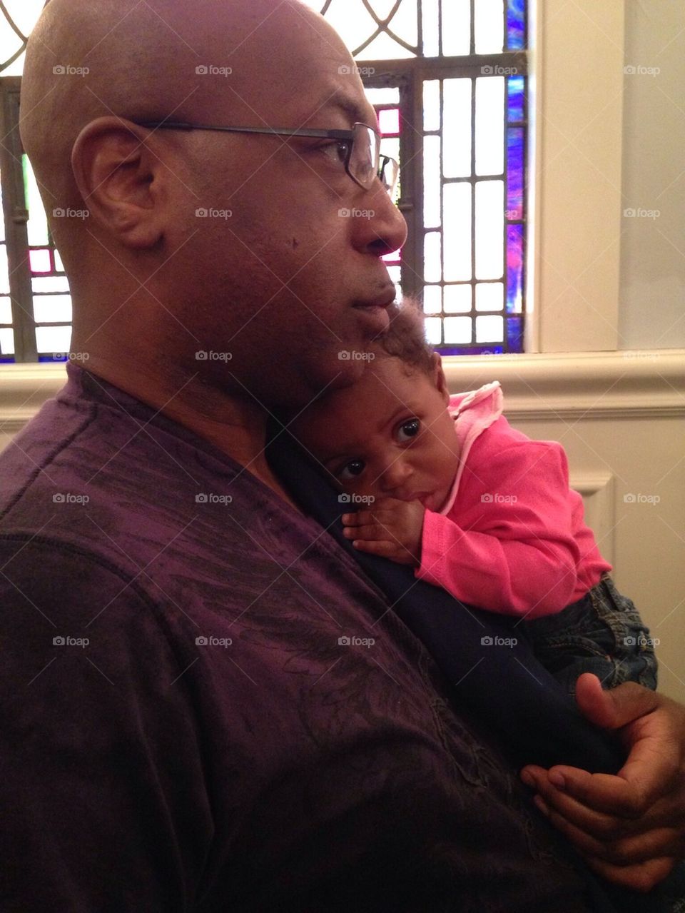 Father and baby in church