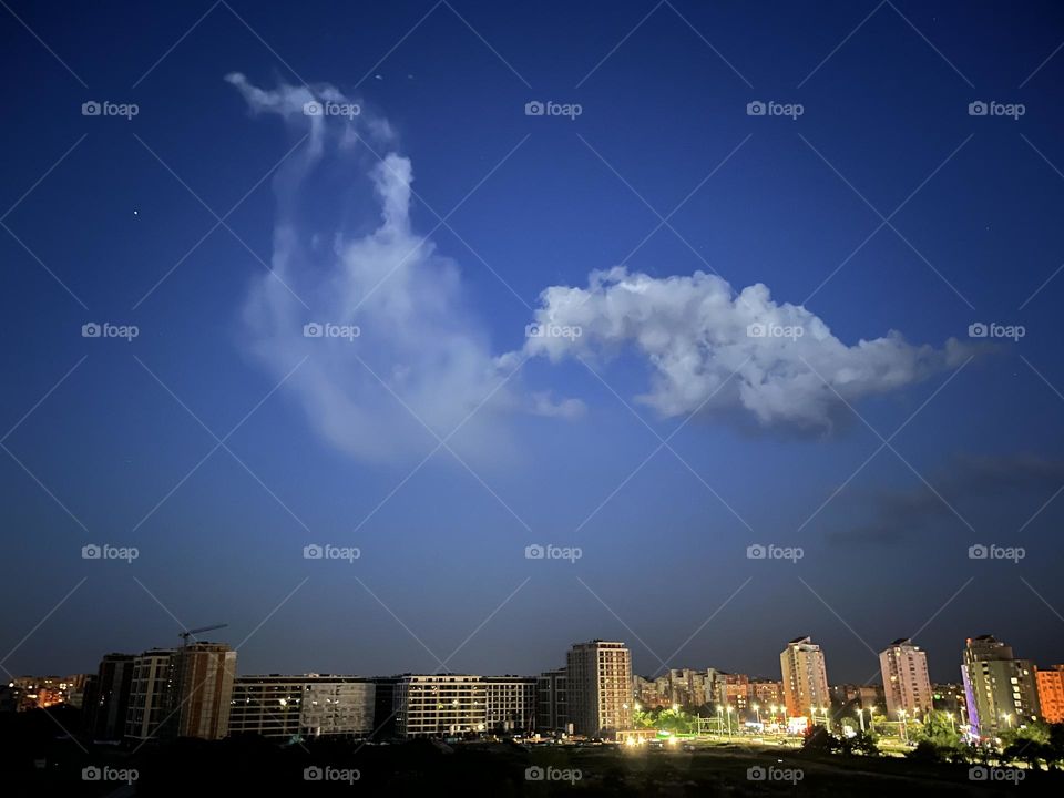 The laughter of clouds and stars in the air.