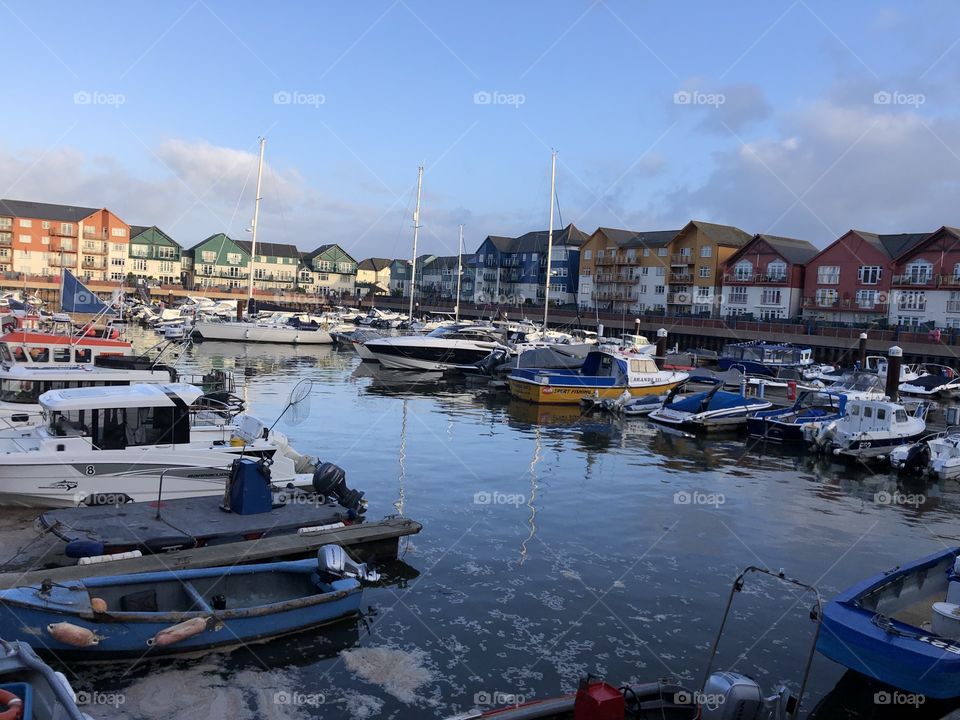 Two photos of early morning sunshine in this luxurious dock land development in Exmouth, Devon, UK