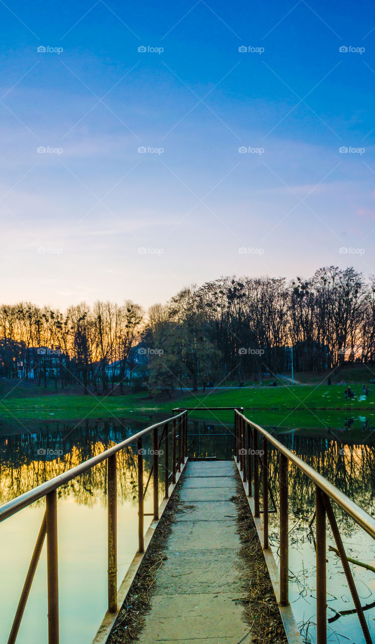 city park with lake in the spring season