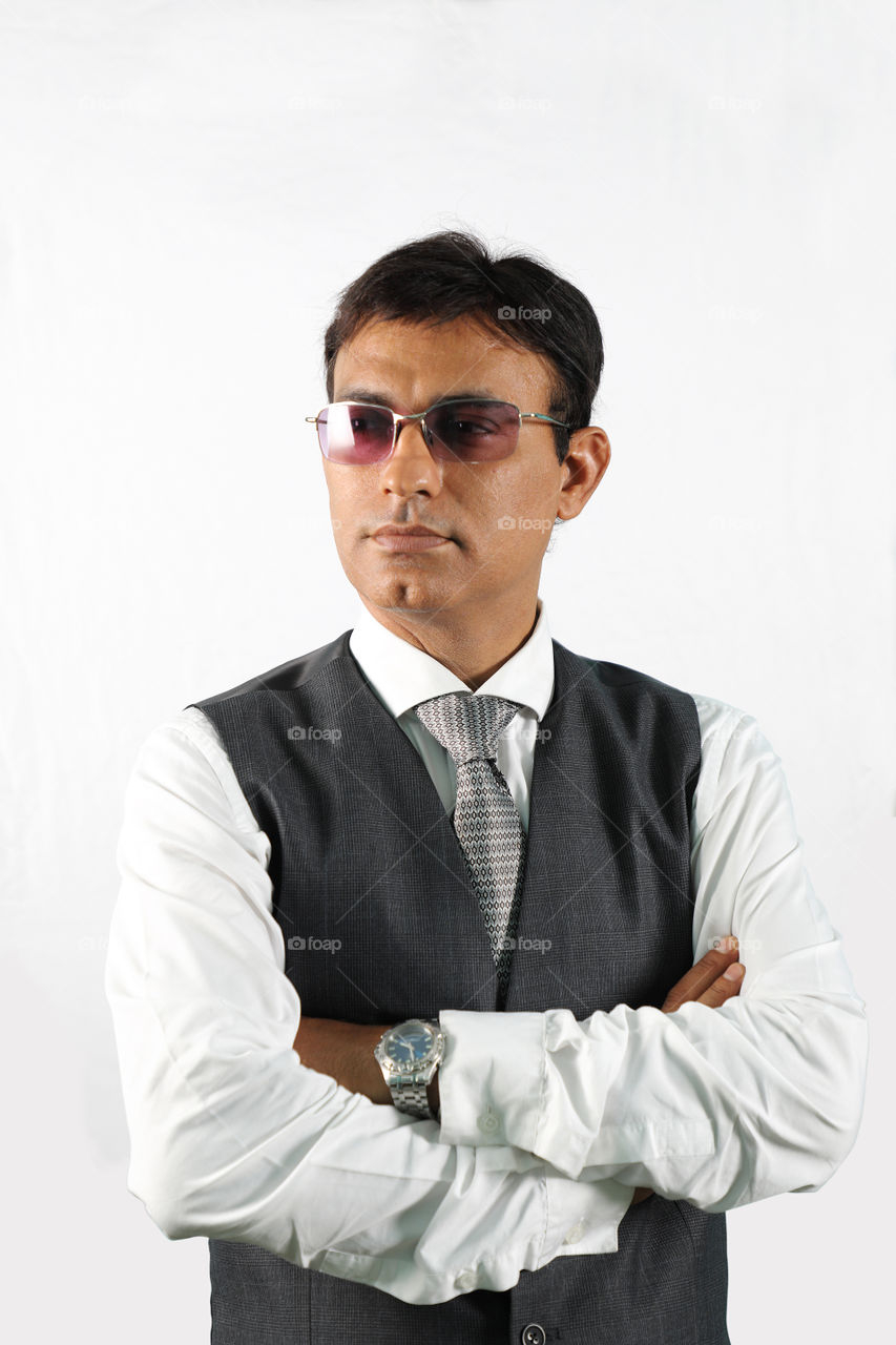Indian businessman executive with sunglasses isolated on white background