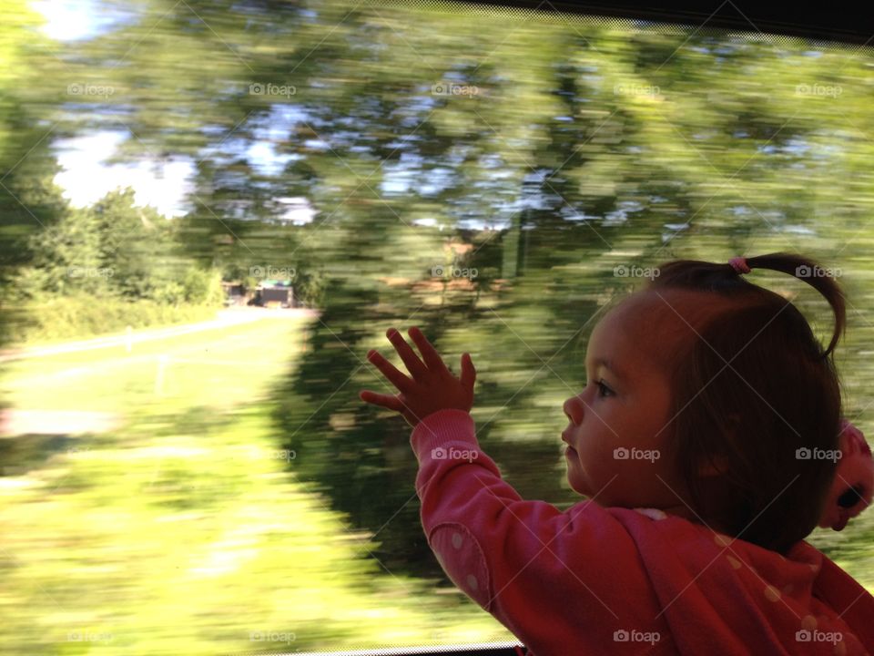What a wonderful world . Baby viewing world through the train's window, fascinating 