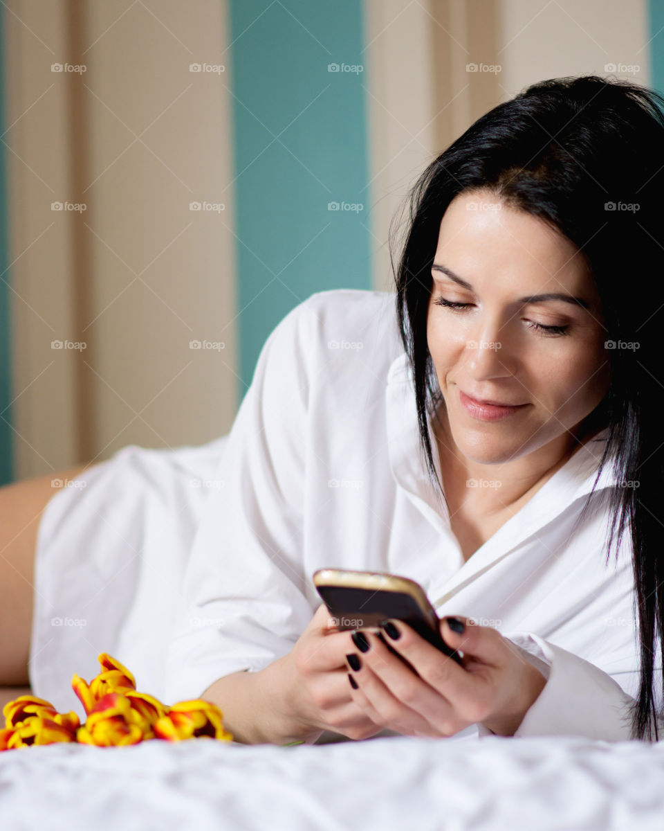 Young woman holding cellphone