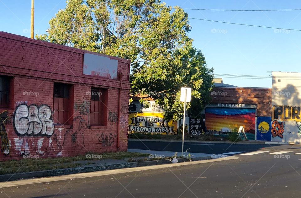 The street art decorating an abandoned warehouse on San Pablo ave in Oakland California.