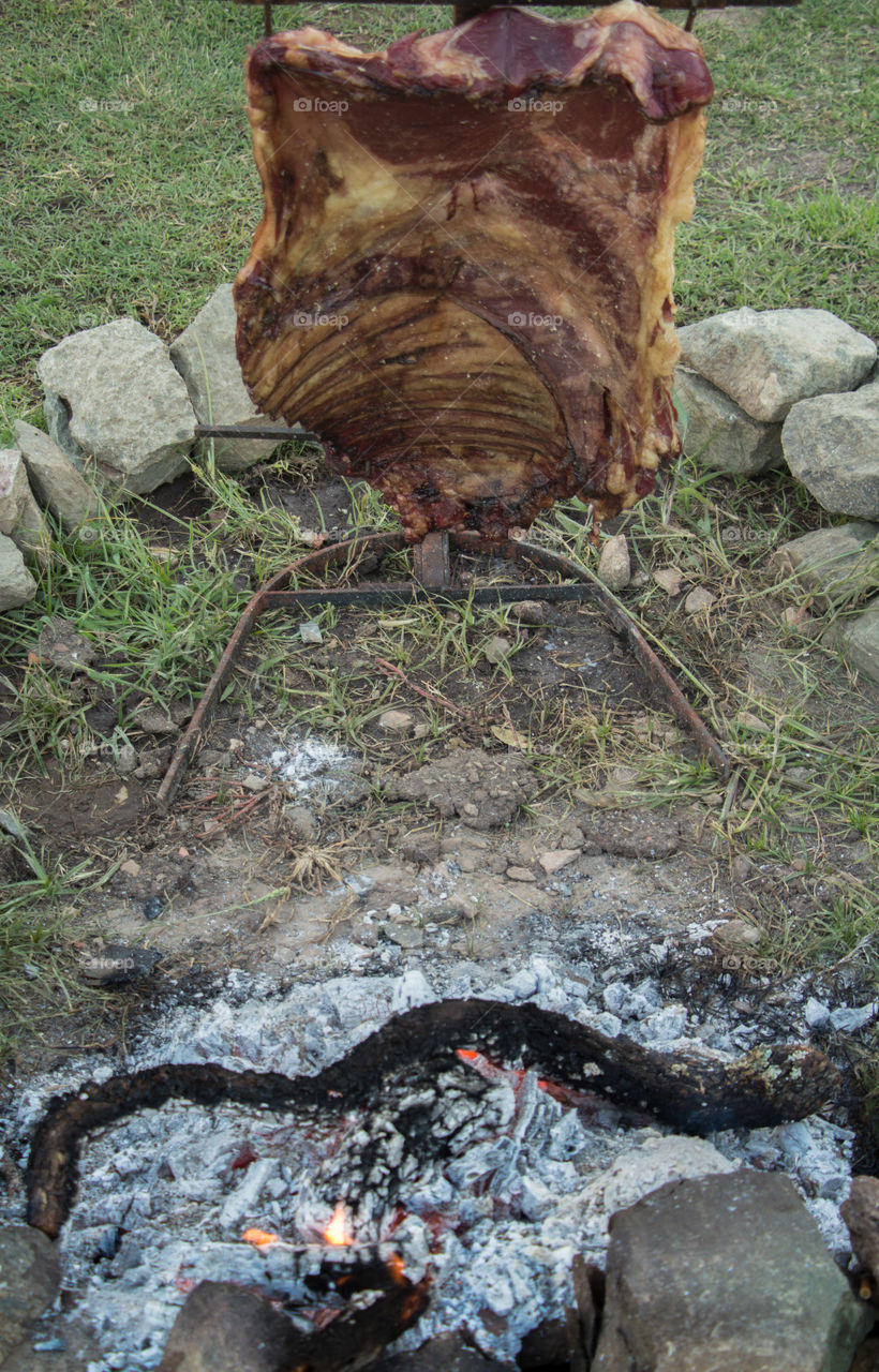 cooking meat at cross