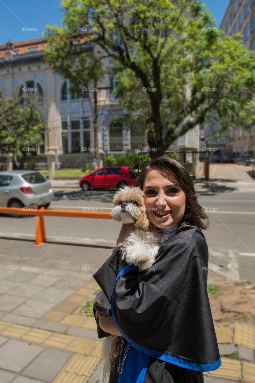 Girl graduating with her dog