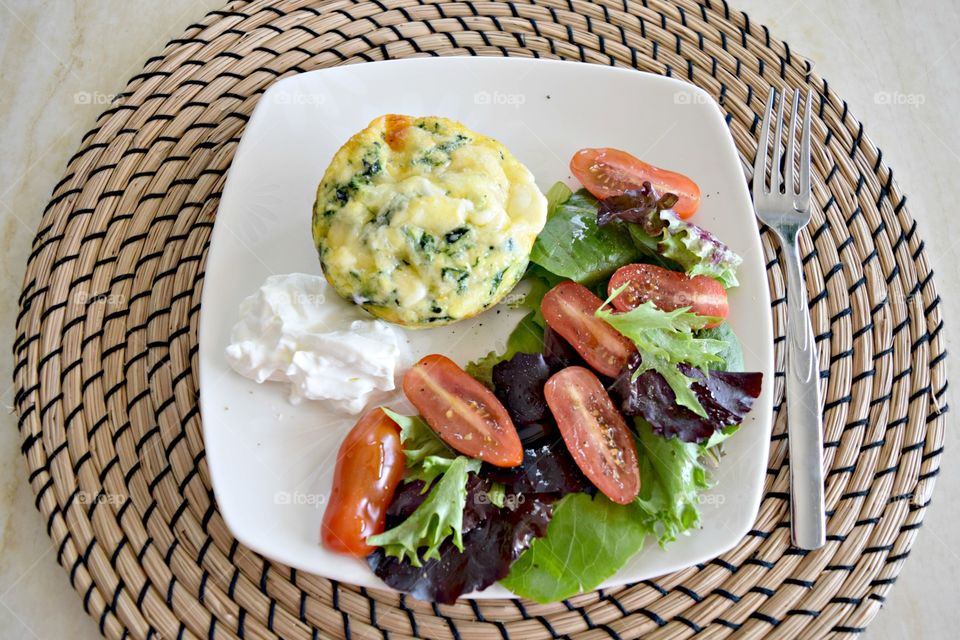 High angle view of salad in plate on wicker