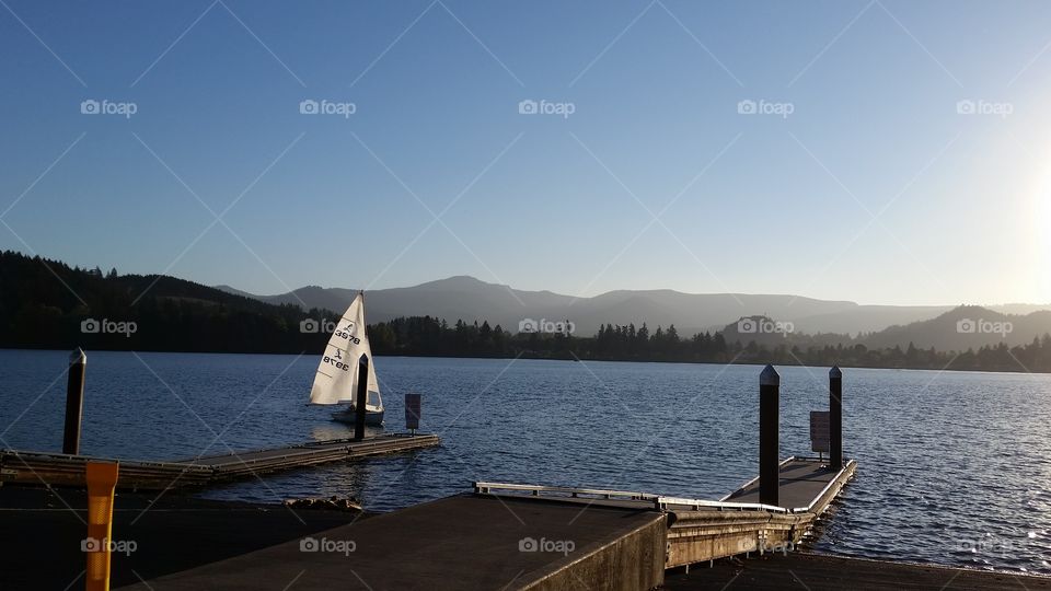 sail boat on lake afternoon sun