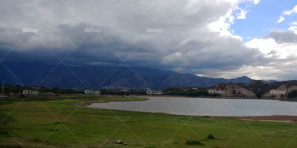 Stormy mountains overlooking the reservoir in Tarija, Bolivia