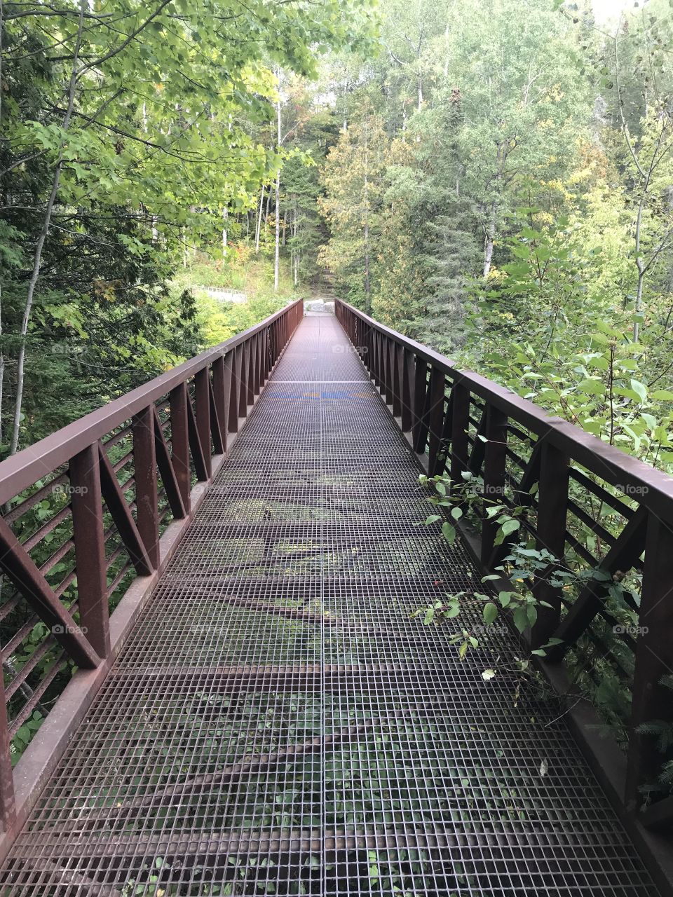 Walk down a metal bridge