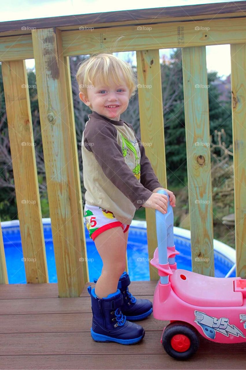 Smiling boy playing with toy