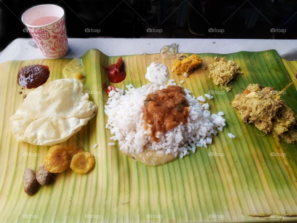 Sadhya (Malayalam: സദ്യ) is a feast of Kerala origin and of importance to all Malayalis, consisting of a variety of traditional vegetarian dishes usually served on a bananaleaf in Kerala, India.