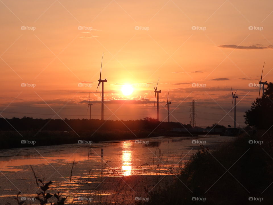 A sunset over a canal