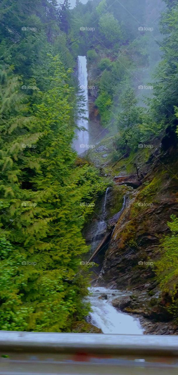 photo of waterfall from a bridge