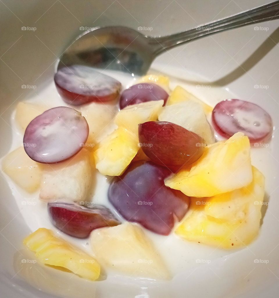 fruit salad. contain pear, apple, pineapple, and grapes...🍐🍎🍏🍍🍇🍜