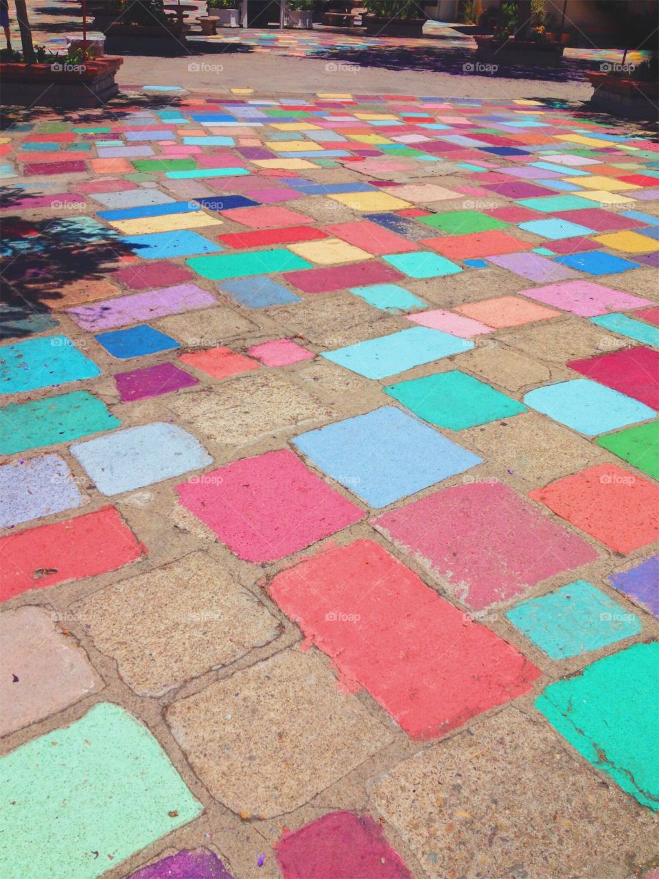 Beautiful colorful paved stone path as the walkway to a local marketplace of pop-up shops in San Diego