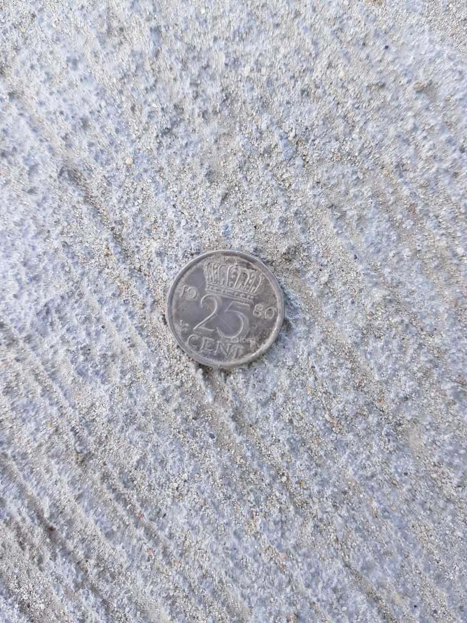 Found 25 cents from 1980 with a metal detector.