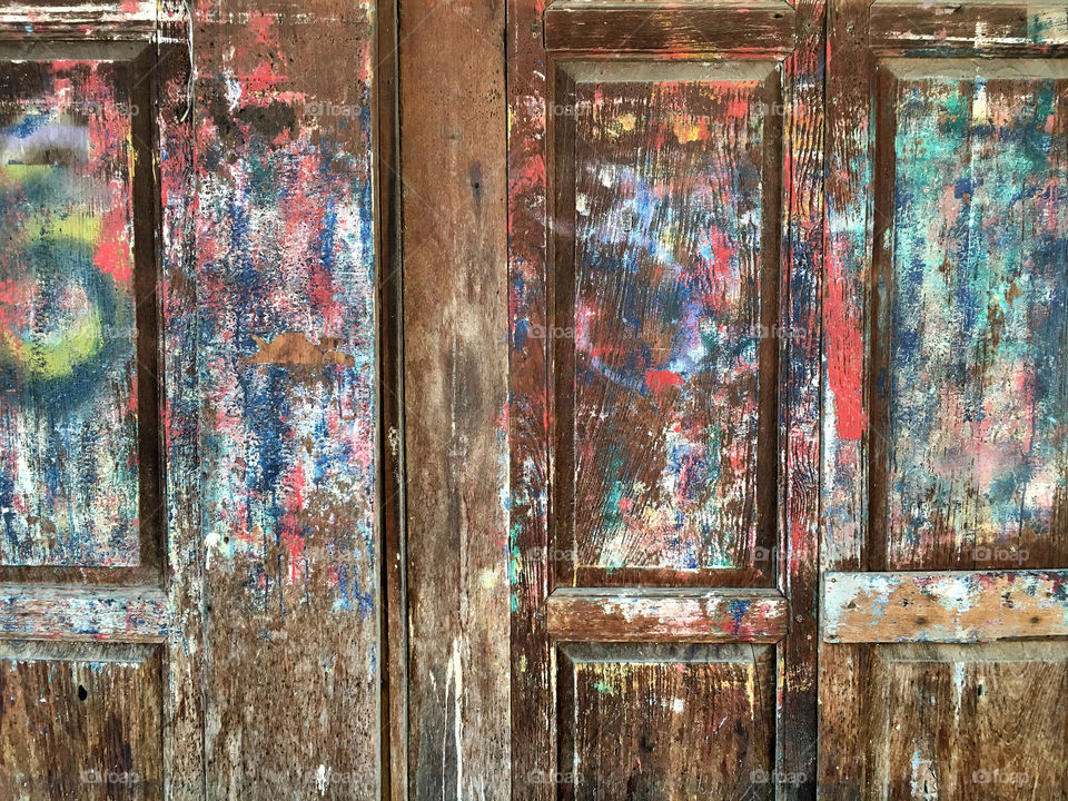 Multicolored paint on vintage wooden doors, Thailand house 