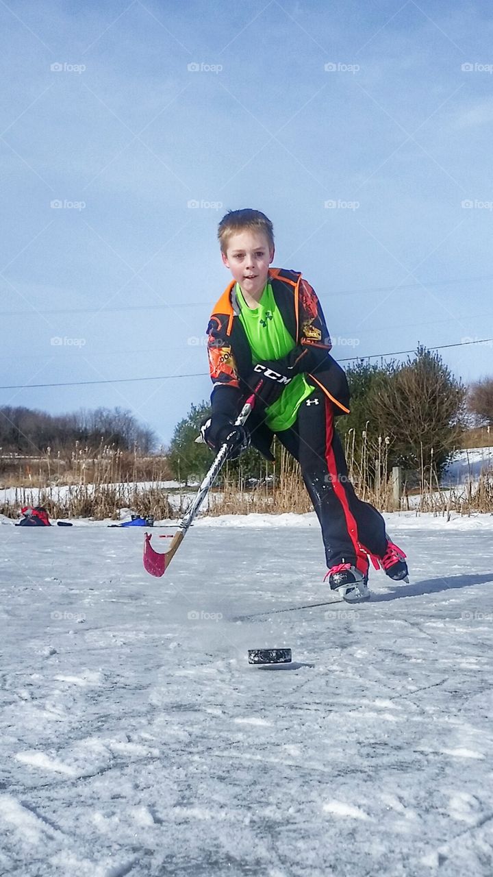 pond ice hockey shot