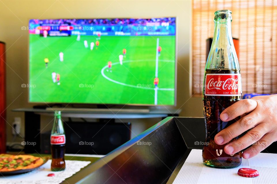 Watching football with Coke