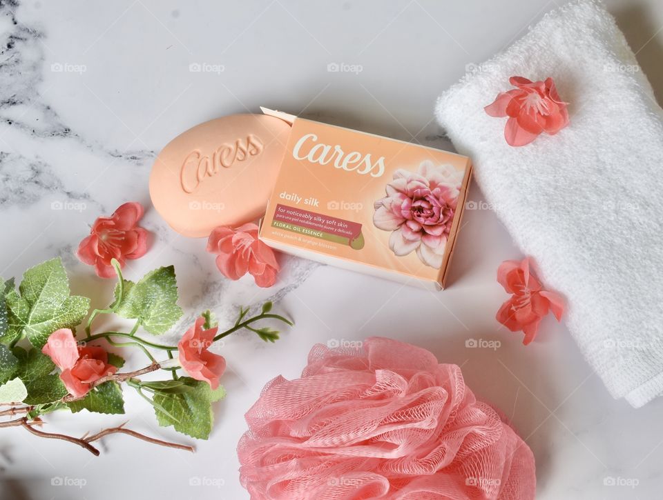 Flat lay still life of caress soap and bath supplies