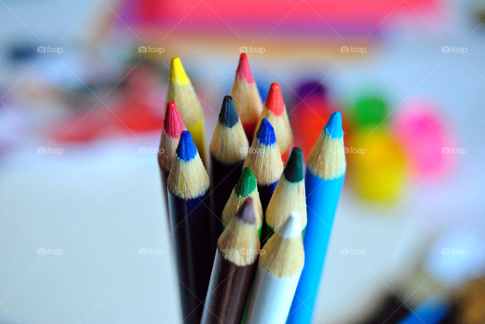 Art supplies, colored pencils, paintbrushes, paint, sketch book, watercolor pad, palette