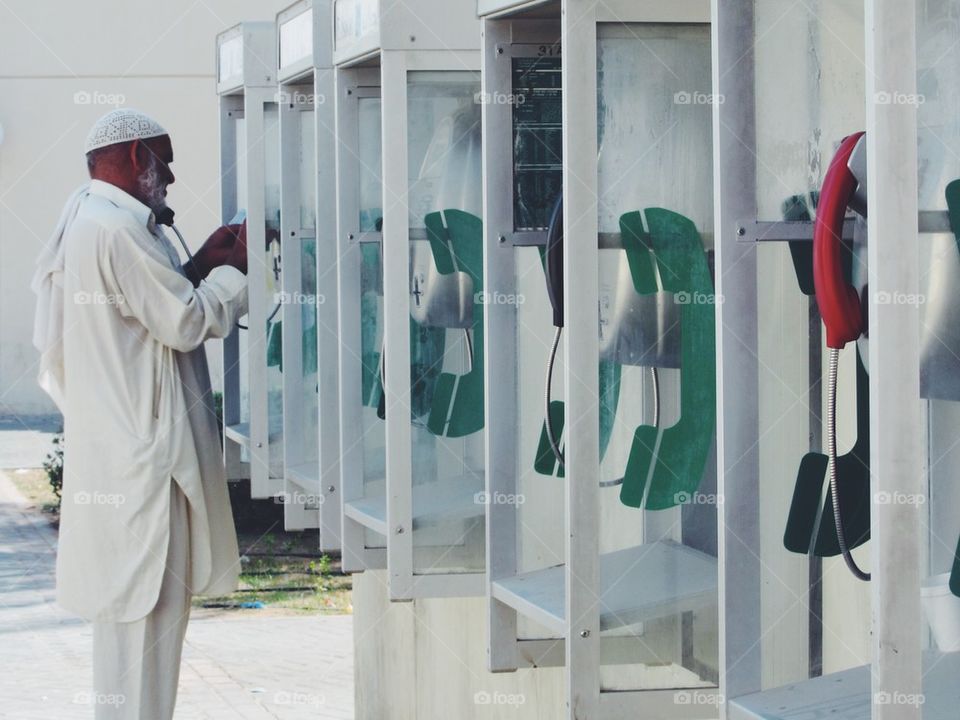 Man on the public payphone